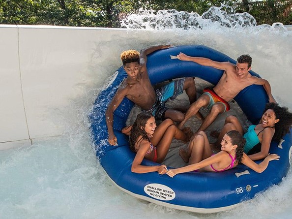 Group of friends on water slide 