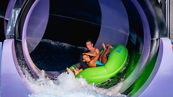 Splish Splash couple on water slide