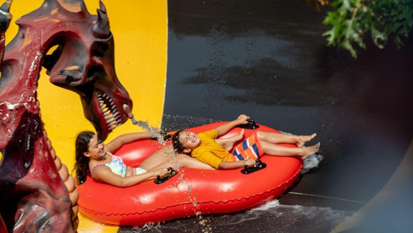 Splish Splash couple on water slide
