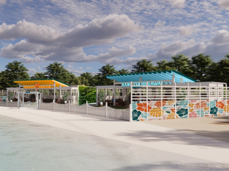 White cabana buildings in front of wavepool