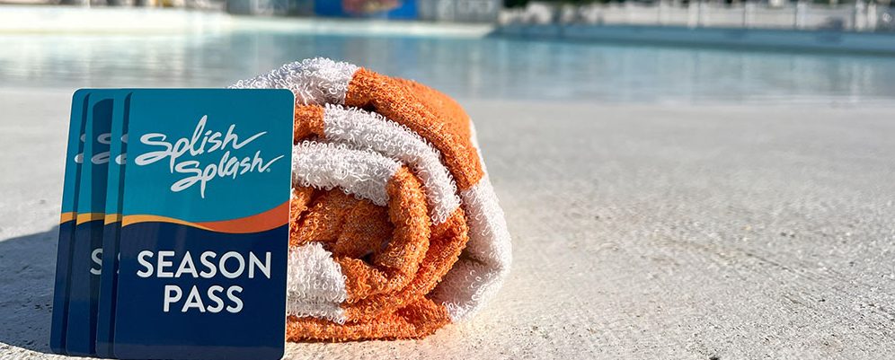 season pass and towel at beach