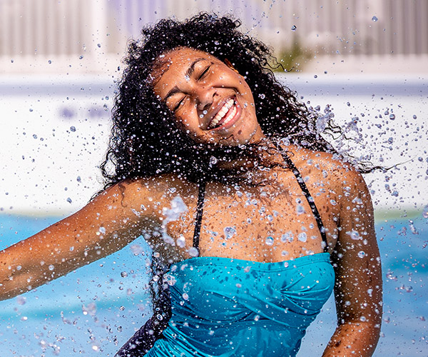 Children sliding and laughing on waterslide